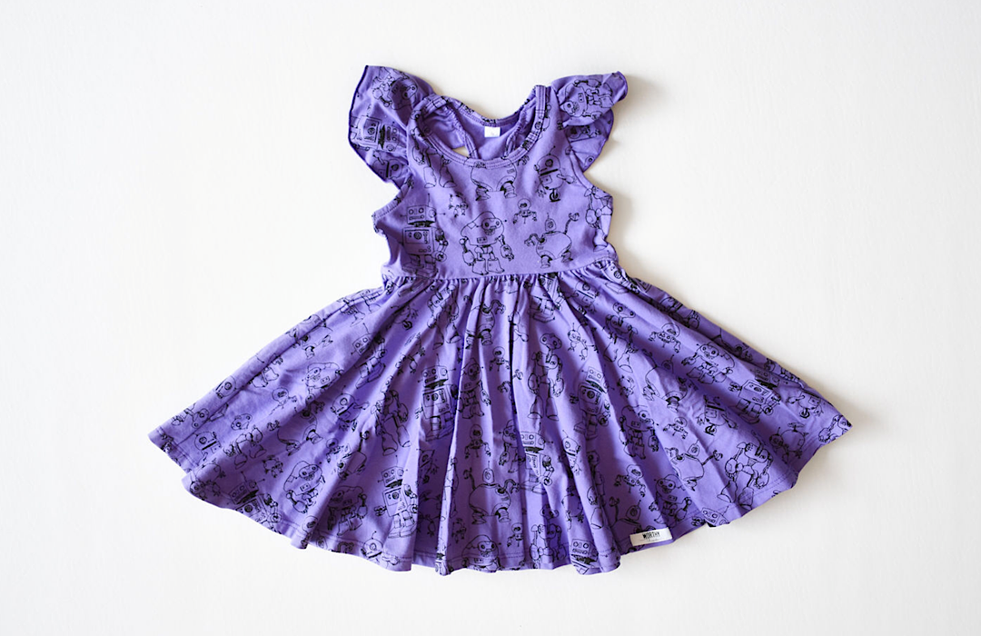 Girls summer twirly dress with ruffle sleeves in purple robots print
